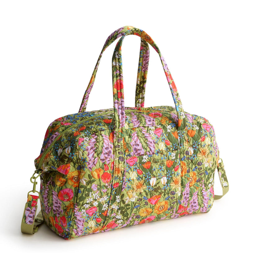 floral patterned weekend bag with adjustable strap and two handles