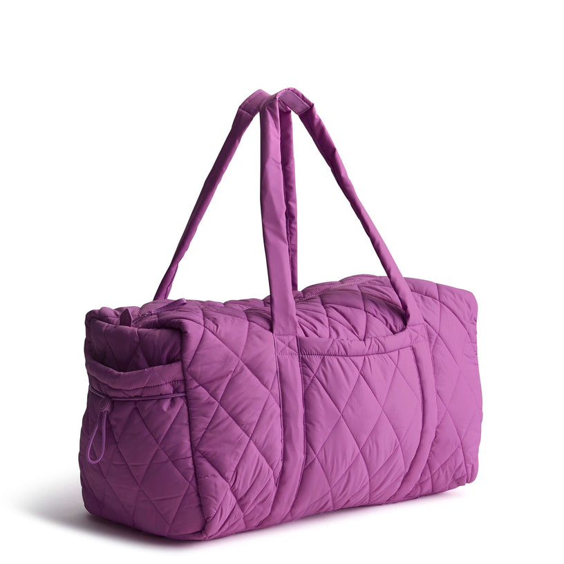 large purple quilted travel duffel bag for women