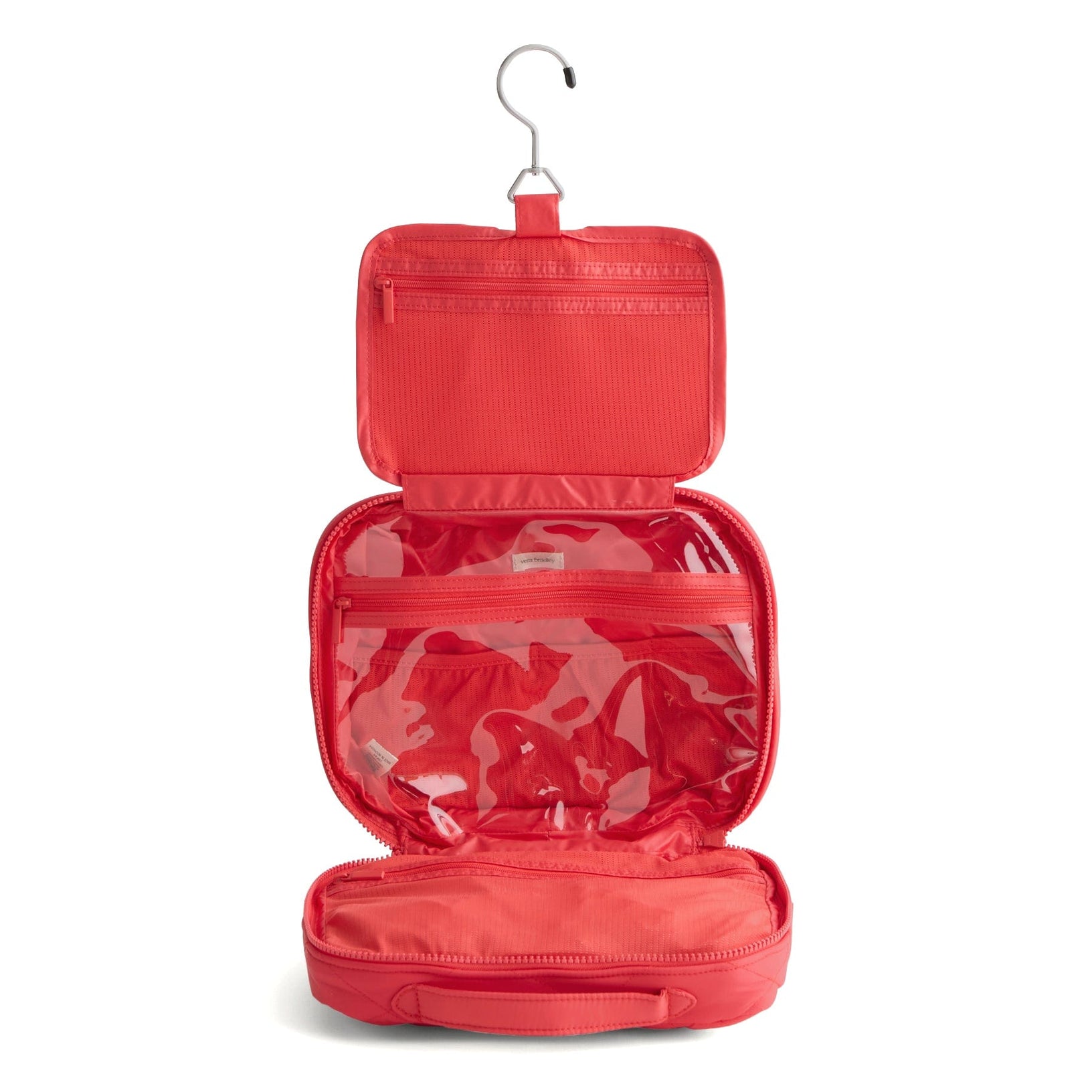 red quilted hanging organizer unfolded to show hanger and 3 sections with zip pockets for toiletries and cosmetics