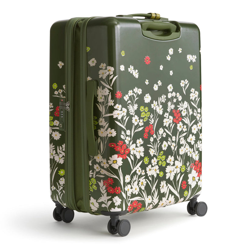 dark green 26 inch spinner suitcase with small white and red flower pattern