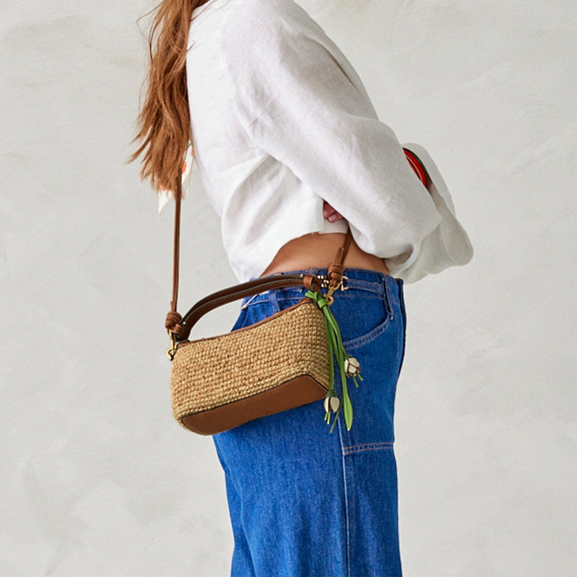 Roxbury light brown raffia crescent crossbody bag with leather handles and strap