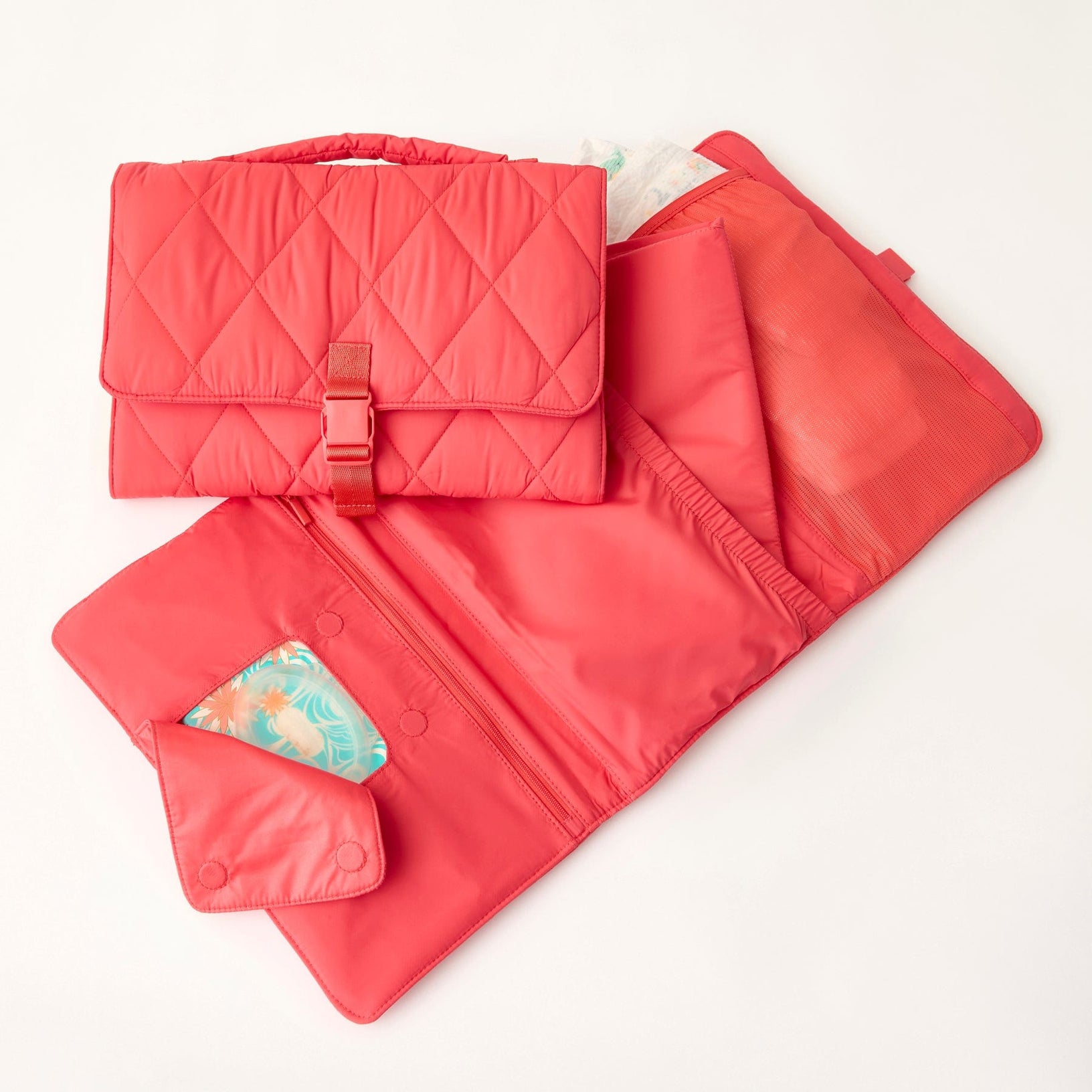 red baby changing pad clutch shown clipped closed and also open with compartments for wipes and diapers